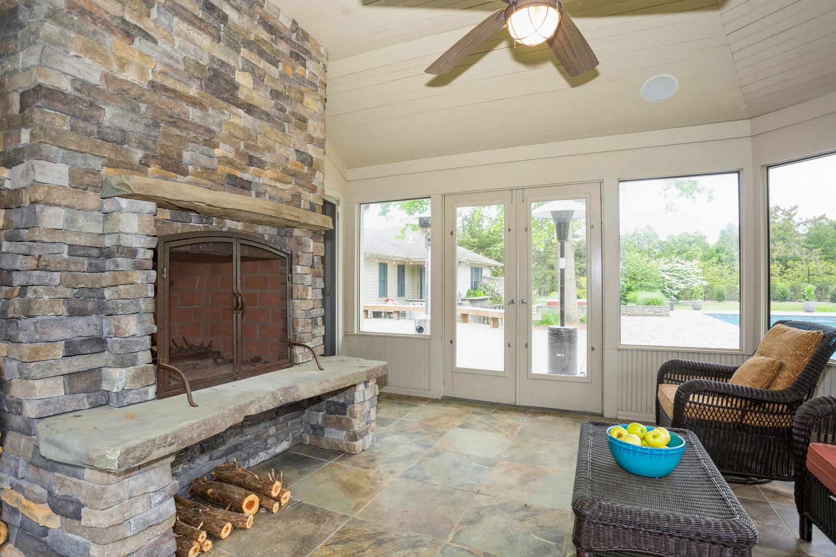  Sunroom with woodburning fireplace- could be a fab place to set up a home office!