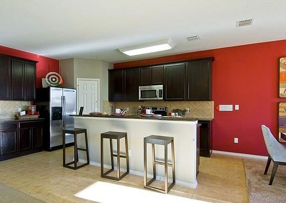 Photo of Model Home with Same Floor Plan, not of Actual Home Listed