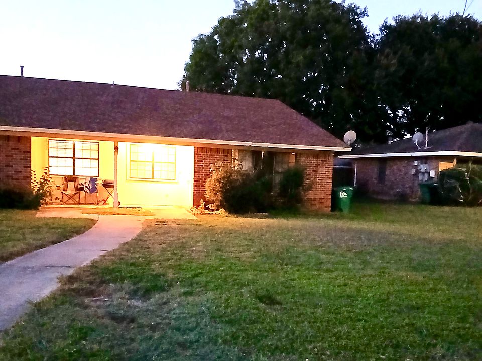 Front door of duplex taken from curb of street.