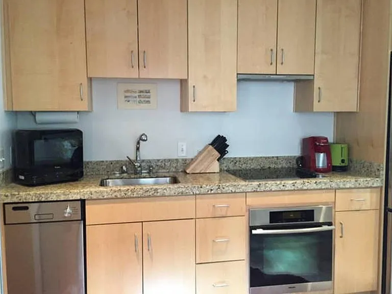 Kitchen w/ disgwasher, microwave & in unit washer/dryer combo