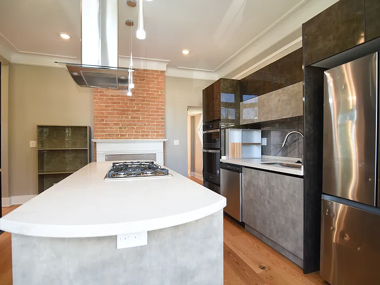 Uber cool contemporary island hood-vent over large island countertop, gas stove,