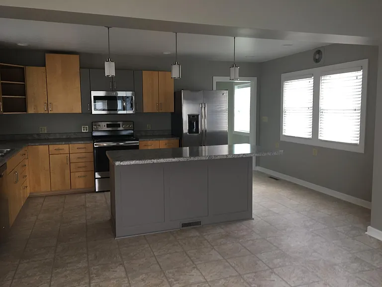 Gourmet kitchen with center island.