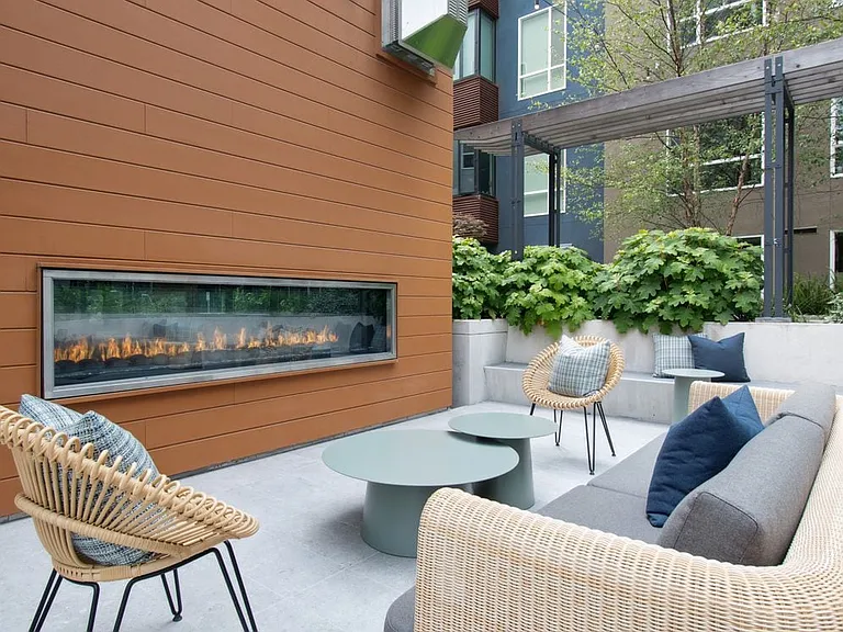 Outdoor resident lounge with common area seating and fireplace