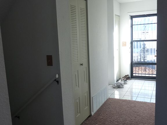 Front entrance and stairs down to finished basement