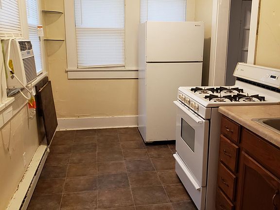 kitchen showing refrigerator and gas stove