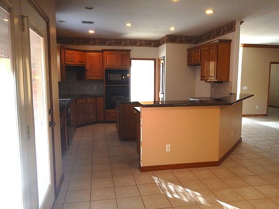 Kitchen with Large island and eating bar, lots of storage