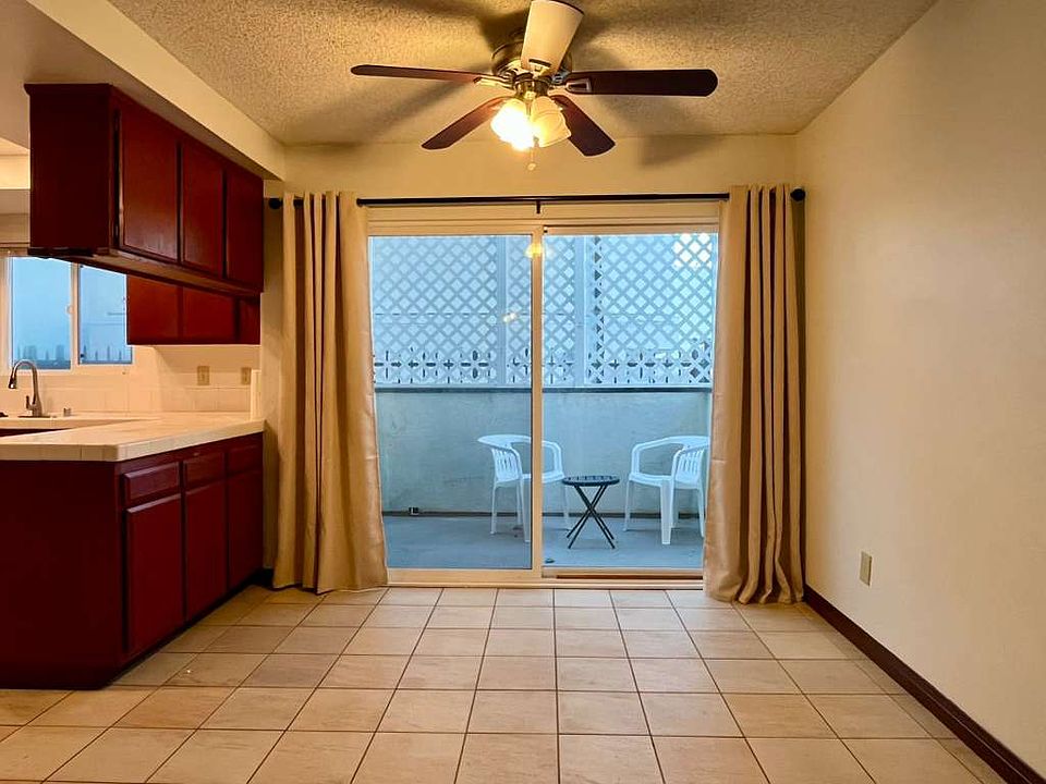 Dining area right of kitchen, sliding doors to private back patio