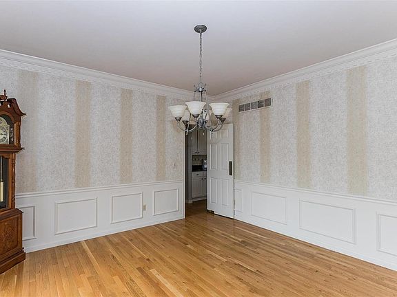 Formal dining room flowing into the gourmet kitchen.