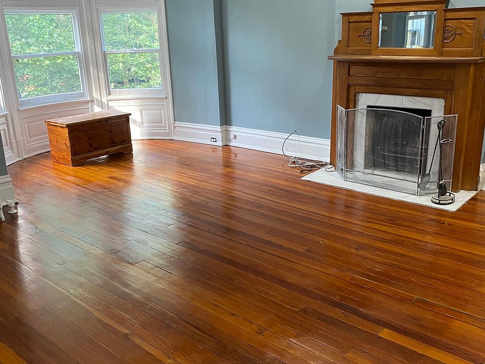 View As You Enter: Curved Bay Windows, Electric Fireplace, Original Floor