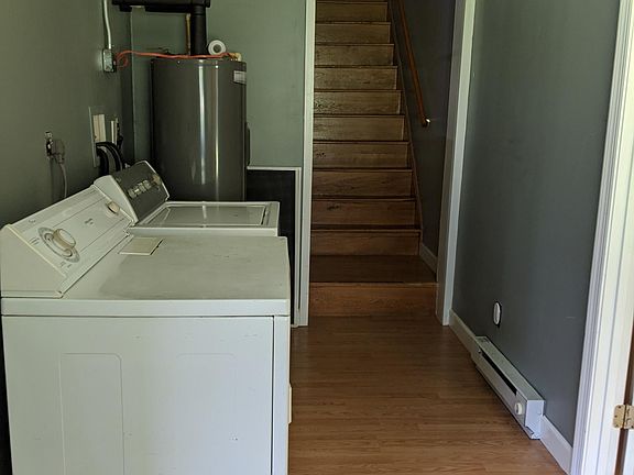 Laundry area and stairway up to second floor bedrooms