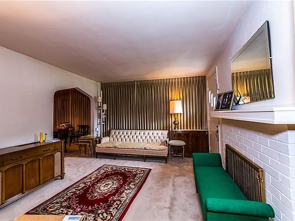 Spacious living room includes a gas fireplace to keep you warm on chilly winter evenings.