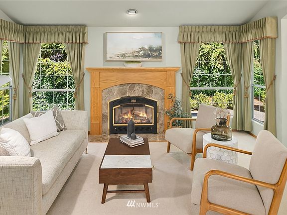 Enjoy this custom surround of the gas fireplace.