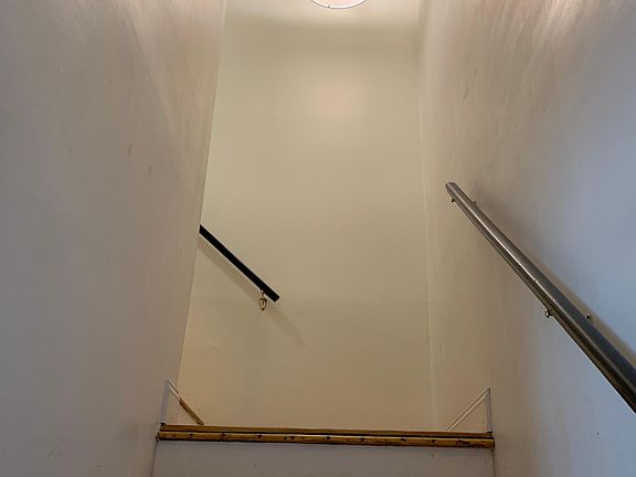 Stairwell and chandelier. All lighting fixtures updated 2019.