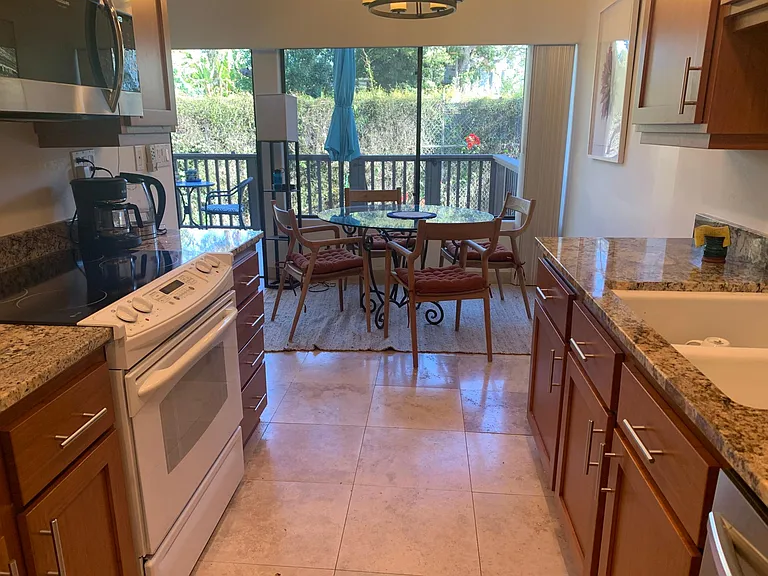 Kitchen looking towards dining room and patio.