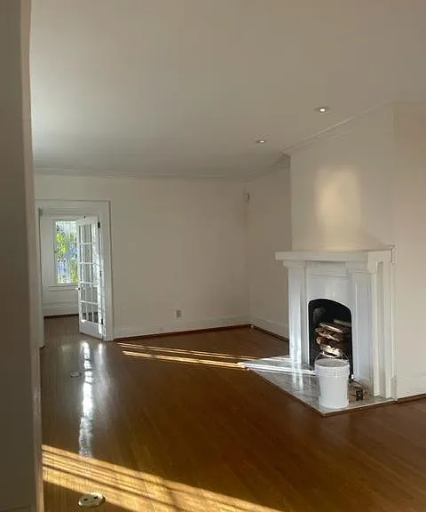 Living room with functional fireplace.