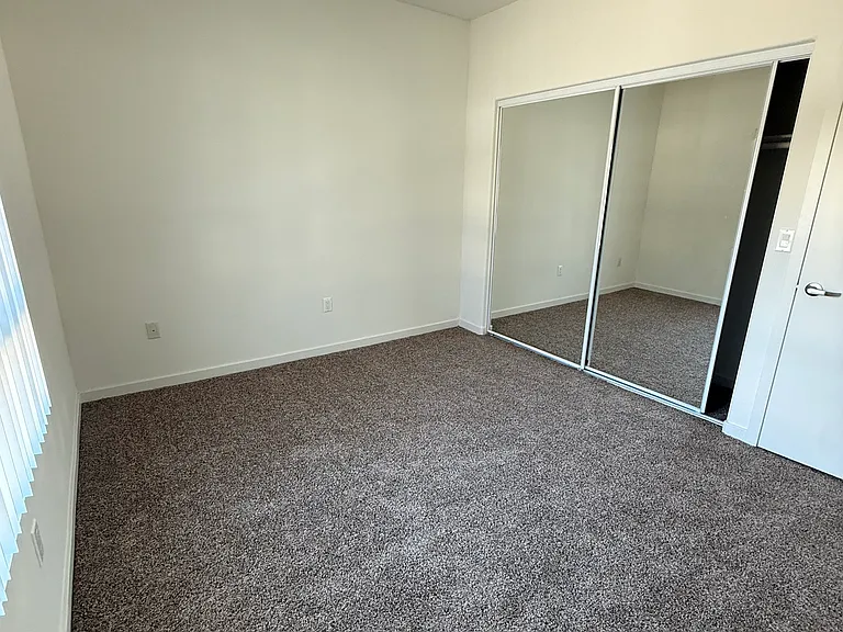 Bedroom #1 with sliding mirror door closet