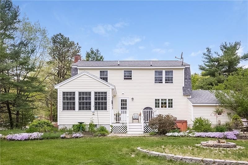 Beautiful, private back yard with perennial gardens, patio, deck and whirlpool.