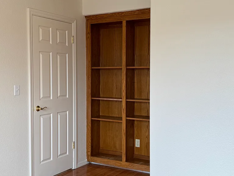 Downstairs Bedroom/Study/Office (10' x 14') has Built-In Bookcase
