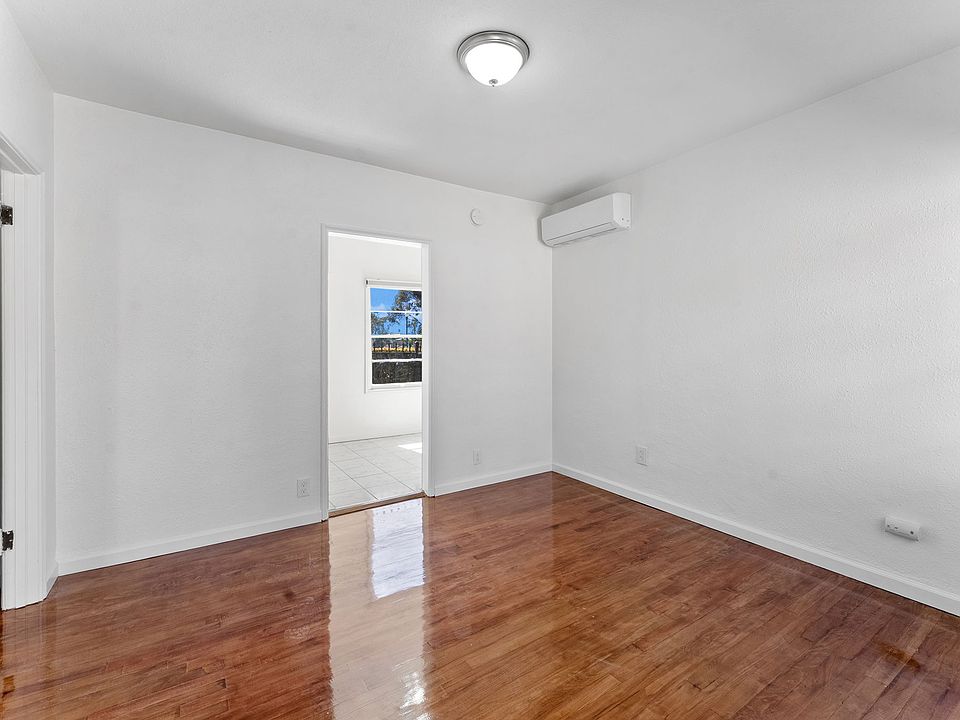 Front door looking into Living Room and door to Kitchen