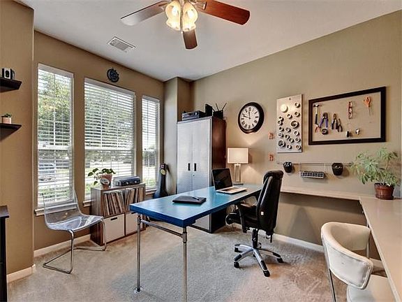 Just off the foyer, this office/study is private, quiet and has ample space for multiple work statio