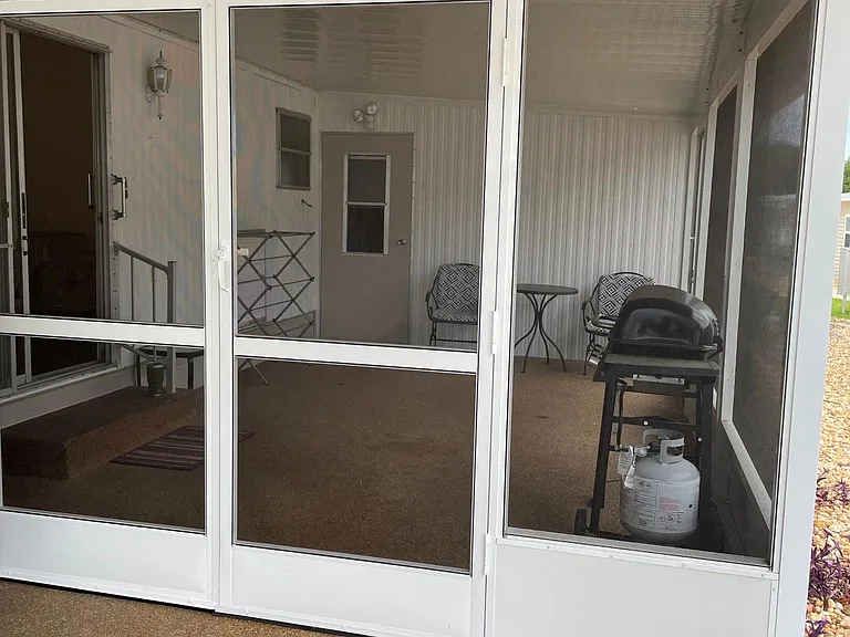 screened in porch
laundry room is in the back of this porch