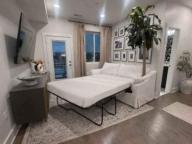 The living room couch converts to a queen-sized mattress.
