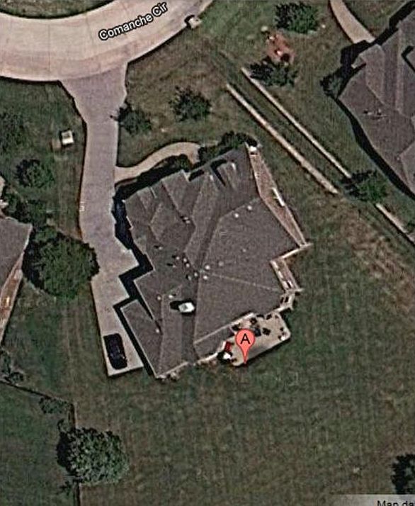 Aerial view of the home and large lot.