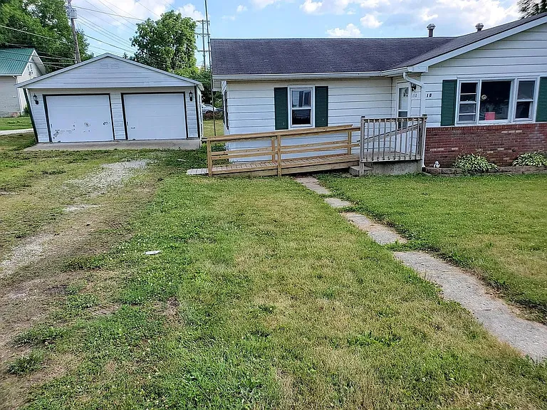 Front of home and garage for parking