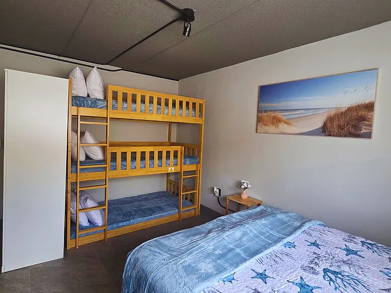 Bunk bed for 3 guests with soft premium linens and pillows