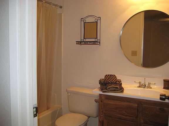 Master bath with new sink, vanity top, faucet and light.