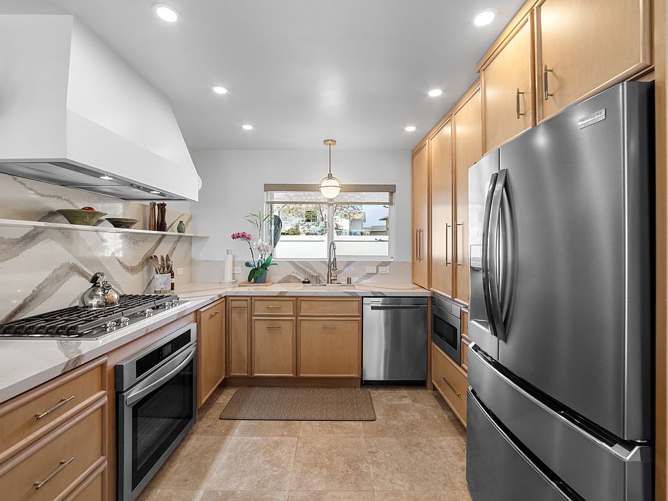 Beautiful custom cabinetry, with coffee cabinet and new drawer microwave