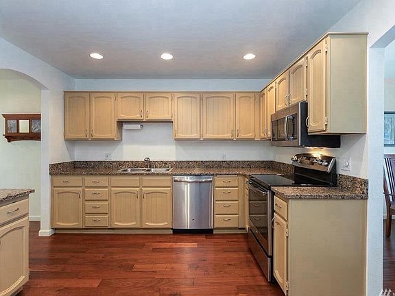 open kitchen with stainless steel appliances