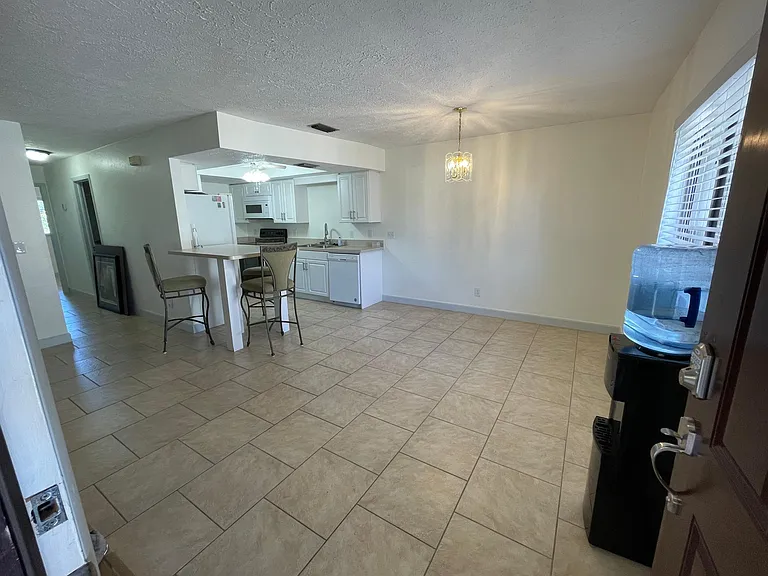 Step inside to the spacious open dining/kitchen/...