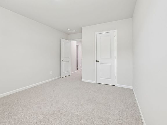 Secondary bedroom in the Chatham floorplan at a Meritage Homes community in Garner, NC.
