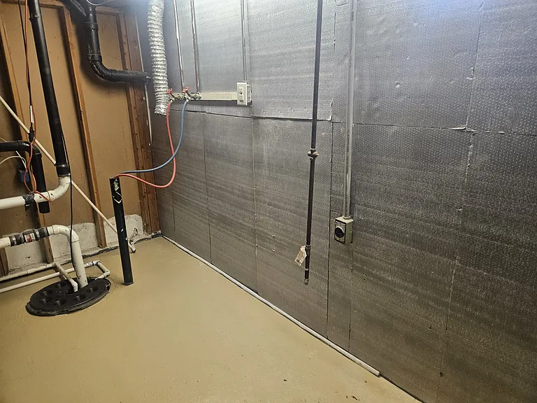 This is the washer/dryer hook ups that are located in the basement. They are behind the stairs when you walk down in another small storage room.