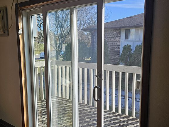 Patio doors lead to private balcony overlooking Liberty Park.