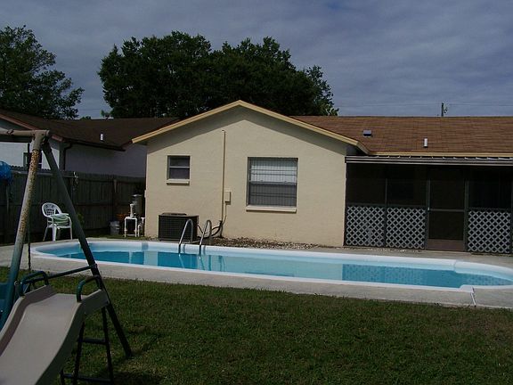 Plenty of room for the kids to play even with the pool! Swingset stays. 