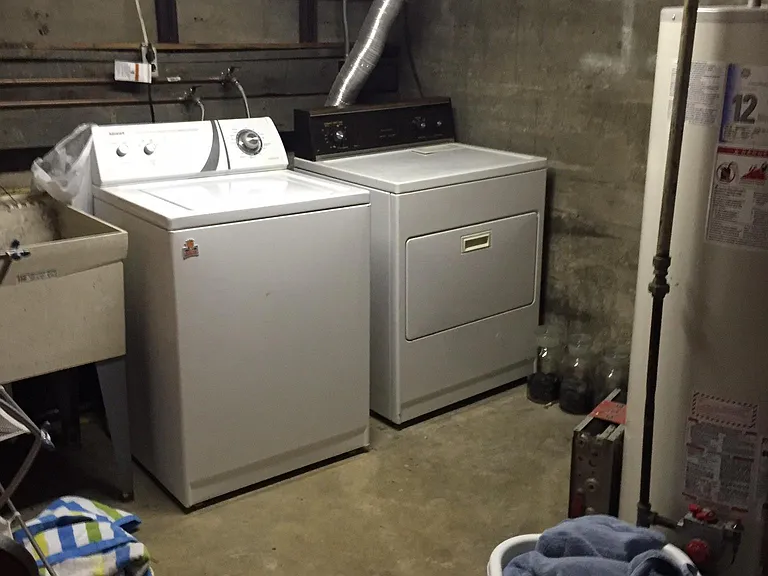 Washer and dryer in basement.