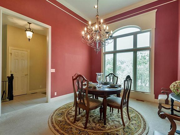 Thirteen foot ceilings, crown moldings and beautiful custom trimmed Palladian window.