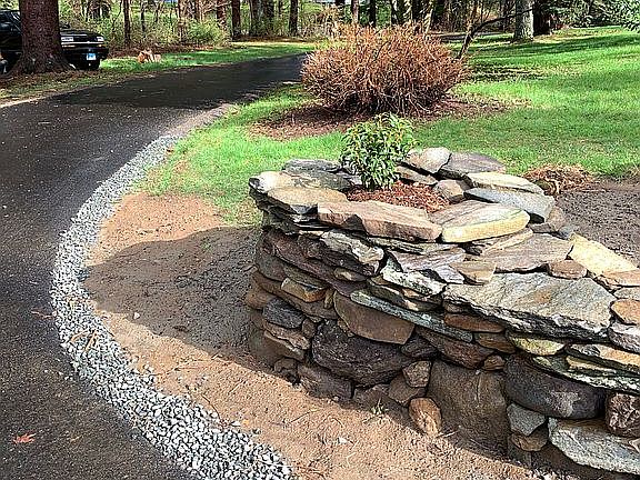 Stone wall by the driveway 