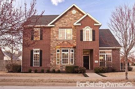 Modern Brick/Stone Design
						:
						Upgraded Board and Batten shutters added Winter 2012