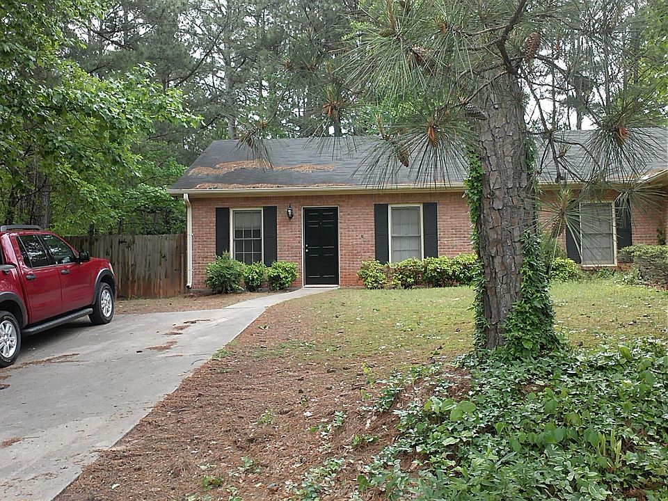 Picturing part of front drive and front entrance.