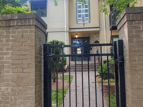 Front entrance view from on street parking for guests. Gated complex. Key fob entrance with intercom system to allow guests to call unit and then be allowed to enter.