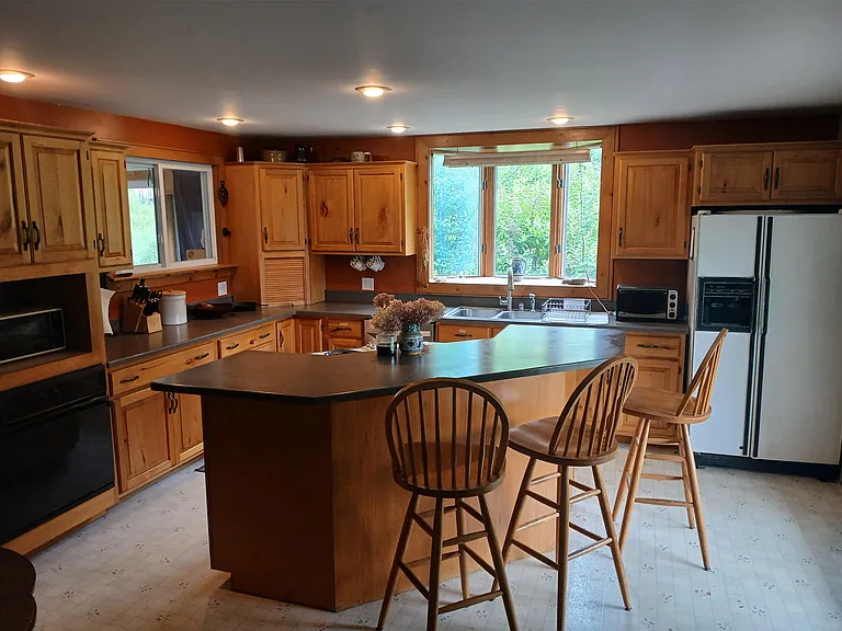 Open plan kitchen with all appliances