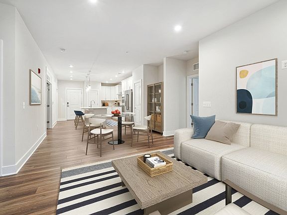 Gathering Room Opening to the Cafe and Gourmet Kitchen - Model Representation