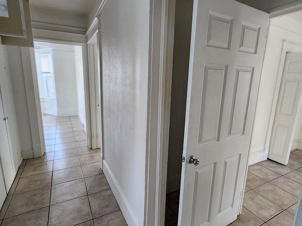 Bedroom 2 on right. Halllway looking down to Living Room