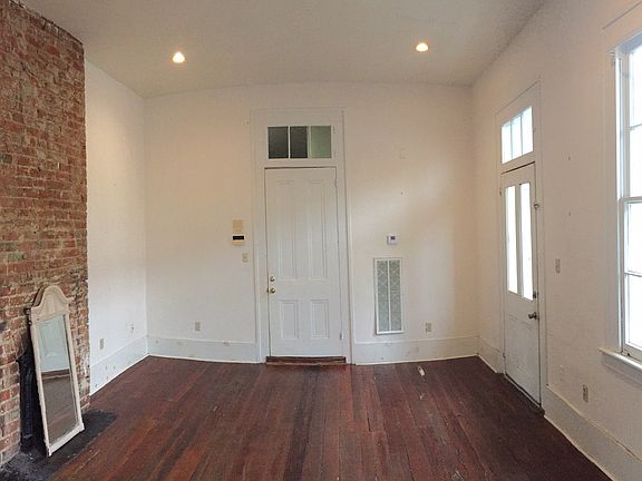 Front door (center) and exterior door (right) in living room