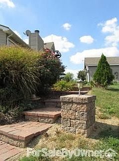 Steps going from the lower patio up