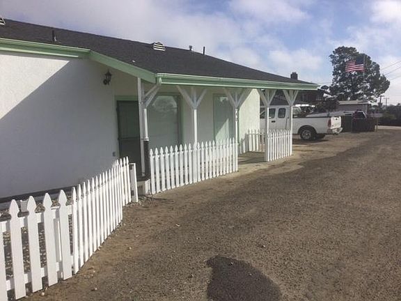 Front porch area Where white truck is, is the parking spaces available for the house