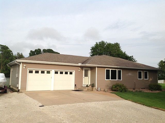 Front of home with 2 car attached garage